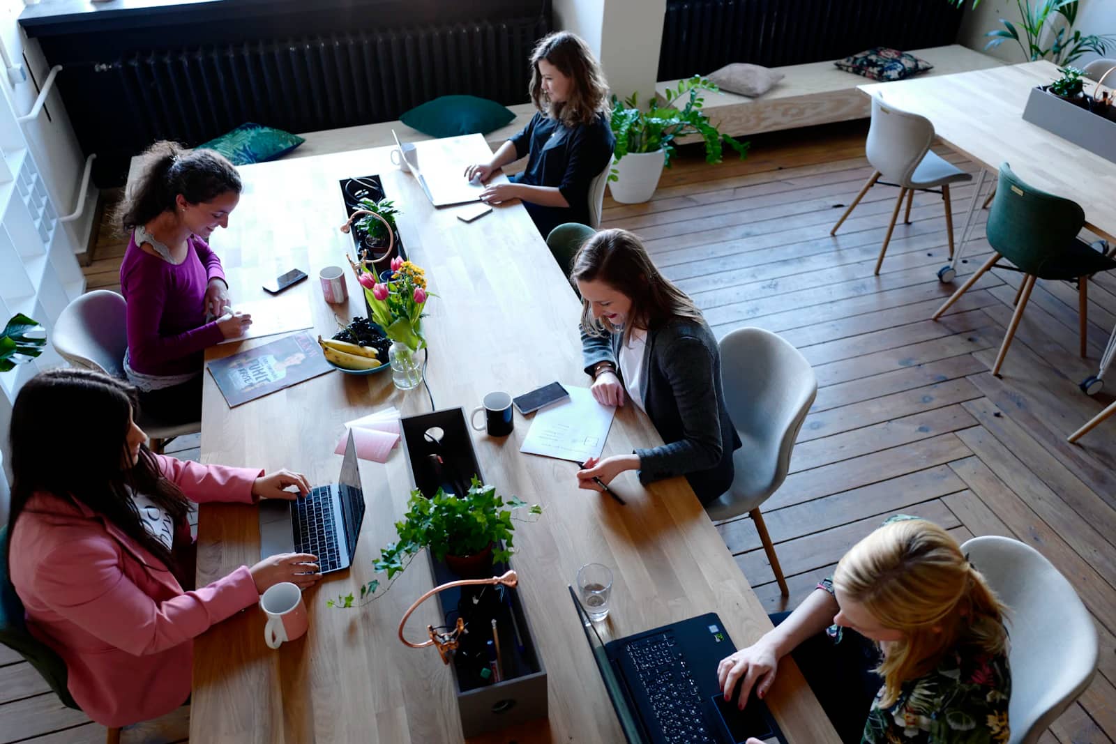 The team working around a large table